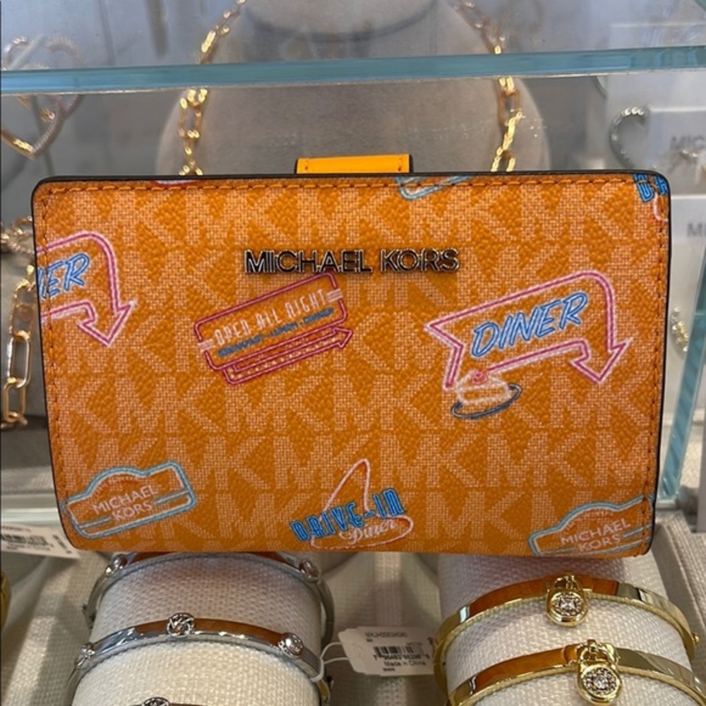 Michael Kors Jet Set Travel Md Printed Signature Logo Bi-Fold Wallet
Pop Orange